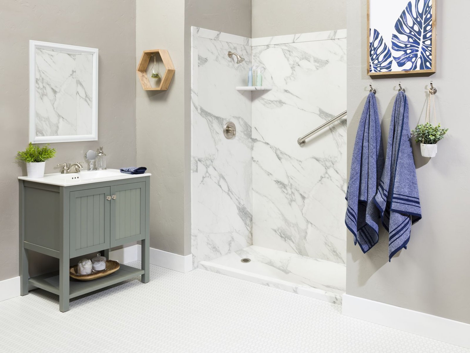 Marble-look walk-in shower with sage vanity
